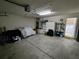 Large two-car garage with ample space leads to an indoor laundry room at 14191 Sw 115Th Ter, Dunnellon, FL 34432