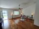 Bright living room with hardwood floors, ceiling fan, and comfortable seating at 14191 Sw 115Th Ter, Dunnellon, FL 34432