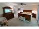 Inviting main bedroom featuring a ceiling fan, neutral walls, and comfortable furniture at 14191 Sw 115Th Ter, Dunnellon, FL 34432