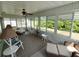 Relaxing sunroom with large windows and abundant natural light, perfect for leisure at 14191 Sw 115Th Ter, Dunnellon, FL 34432