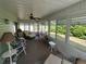 Relaxing sunroom with large windows and abundant natural light, perfect for leisure at 14191 Sw 115Th Ter, Dunnellon, FL 34432