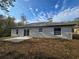 Back of the house featuring a sliding glass door to access the outside patio at 15 Locust Trak, Ocala, FL 34472