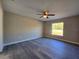 Empty bedroom with a ceiling fan and light gray flooring, ready for customization at 15 Locust Trak, Ocala, FL 34472