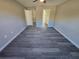 Empty bedroom with light gray flooring and views to closet and bath at 15 Locust Trak, Ocala, FL 34472