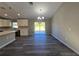 Open dining area next to the kitchen featuring light-colored walls, modern lighting, and sliding glass doors at 15 Locust Trak, Ocala, FL 34472