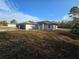 Attractive single-story home with a spacious driveway and a neatly maintained yard at 15 Locust Trak, Ocala, FL 34472