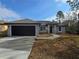 Charming single-story home with a two-car garage and inviting front entrance at 15 Locust Trak, Ocala, FL 34472