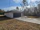 View of the home's attached garage and driveway at 15 Locust Trak, Ocala, FL 34472
