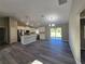Modern kitchen and dining area featuring stainless steel appliances, white cabinets, and a center island at 15 Locust Trak, Ocala, FL 34472