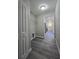 Laundry room featuring a wire shelf, hookups, and vinyl floors, with access to the kitchen at 15 Locust Trak, Ocala, FL 34472