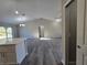 Open floorplan with a spacious living room and dining area featuring gray wood-look floors at 15 Locust Trak, Ocala, FL 34472