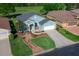 Beautiful home with a well-manicured lawn, rock garden feature, mature trees and lovely landscaping at 15092 Sw 14Th Avenue Rd, Ocala, FL 34473