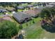 Aerial view of home featuring backyard, lawn, trees, and patio at 15092 Sw 14Th Avenue Rd, Ocala, FL 34473