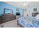 Bright bedroom with blue walls, carpet, and ample closet space at 15092 Sw 14Th Avenue Rd, Ocala, FL 34473