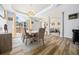 Bright dining room features hard-wood floors, tray ceiling, and a clear view to a nicely decorated living space at 15092 Sw 14Th Avenue Rd, Ocala, FL 34473