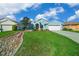 Here is a gorgeous home with great curb appeal, landscaping, a paver pathway, and a neutral color palette at 15092 Sw 14Th Avenue Rd, Ocala, FL 34473