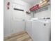 Efficient laundry room with washer, dryer, and ample storage space at 15092 Sw 14Th Avenue Rd, Ocala, FL 34473