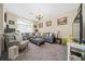 Cozy living room features a plush sectional sofa and decorative accents for a comfortable and inviting space at 15092 Sw 14Th Avenue Rd, Ocala, FL 34473