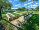 Outdoor shuffleboard courts with benches and manicured lawns, offering a recreational amenity for residents at 15092 Sw 14Th Avenue Rd, Ocala, FL 34473