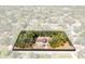 Aerial view showcasing the home surrounded by lush, mature trees and a well-maintained landscape at 1533 Pine St, Apopka, FL 32703