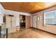 Cozy bedroom features hardwood floors and a wood ceiling at 1533 Pine St, Apopka, FL 32703