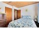 Bedroom features hardwood floors, wood ceiling, and ample natural light at 1533 Pine St, Apopka, FL 32703