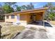 Single-story home boasting a convenient, attached covered carport, providing protection from the elements at 1533 Pine St, Apopka, FL 32703