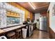 Kitchen featuring a wooden countertop, stainless steel appliances, and lots of natural light at 1533 Pine St, Apopka, FL 32703