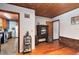 Open living room space with hardwood floors and an open view into the kitchen at 1533 Pine St, Apopka, FL 32703