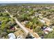 A birds-eye view showcasing the home within a tranquil, tree-lined neighborhood, highlighting its peaceful setting at 1533 Pine St, Apopka, FL 32703