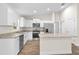 Modern kitchen featuring white cabinets, granite countertops, and stainless steel appliances at 2722 Sw 151St Ave, Ocala, FL 34481