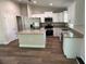 Contemporary kitchen equipped with stainless steel appliances and a functional center island at 2722 Sw 151St Ave, Ocala, FL 34481