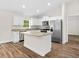 Bright kitchen with modern appliances, granite countertops, and a stylish kitchen island at 2722 Sw 151St Ave, Ocala, FL 34481