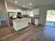 Modern kitchen featuring stainless steel appliances, granite countertops, and stylish white cabinets at 2722 Sw 151St Ave, Ocala, FL 34481