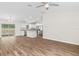 The open living room flows into the kitchen, with wood-look floors and neutral colors at 2722 Sw 151St Ave, Ocala, FL 34481