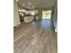 Inviting living space showcasing beautiful flooring and seamless access to an open-concept kitchen at 2722 Sw 151St Ave, Ocala, FL 34481