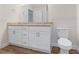 Bathroom showcasing a granite countertop, double sink vanity, and wood-look flooring at 2722 Sw 151St Ave, Ocala, FL 34481