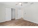 Bedroom featuring wood-look floors, closet and neutral paint at 2722 Sw 151St Ave, Ocala, FL 34481