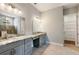 Modern bathroom with double vanity, granite countertop, and separate walk-in closet at 2735 Se 19Th Ct, Ocala, FL 34471
