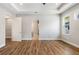 Bright bedroom with wood floors, a ceiling fan, and an open doorway at 2735 Se 19Th Ct, Ocala, FL 34471