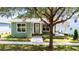 Charming green home with a landscaped front yard and inviting porch at 2735 Se 19Th Ct, Ocala, FL 34471