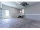 Spacious garage with concrete floors, stairs to upper level, and bright lighting at 2735 Se 19Th Ct, Ocala, FL 34471