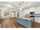 Kitchen with stone countertops, stainless appliances, and an island which adjoins the living space at 2735 Se 19Th Ct, Ocala, FL 34471