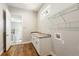 Laundry room with granite counters, sink, and shelving at 2735 Se 19Th Ct, Ocala, FL 34471