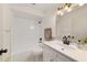 Updated bathroom featuring a vanity with marble countertop, black fixtures and a shower-tub combo at 3380 Ne 42Nd Pl, Ocala, FL 34479