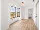 Bright bedroom with a bay window, laminate floors, and a closet at 3380 Ne 42Nd Pl, Ocala, FL 34479