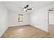 Spacious bedroom featuring a ceiling fan, natural light, and neutral walls at 3380 Ne 42Nd Pl, Ocala, FL 34479