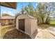 Newer metal storage shed in the backyard provides additional storage space, set on a concrete pad at 3380 Ne 42Nd Pl, Ocala, FL 34479