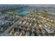 Expansive aerial shot of a community with the property highlighted, showcasing its setting near recreational areas and amenities at 3407 Melbourne Ln, The Villages, FL 32163