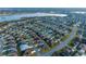 Scenic aerial view of the property's location within a vibrant community near a serene lake and recreational areas at 3407 Melbourne Ln, The Villages, FL 32163